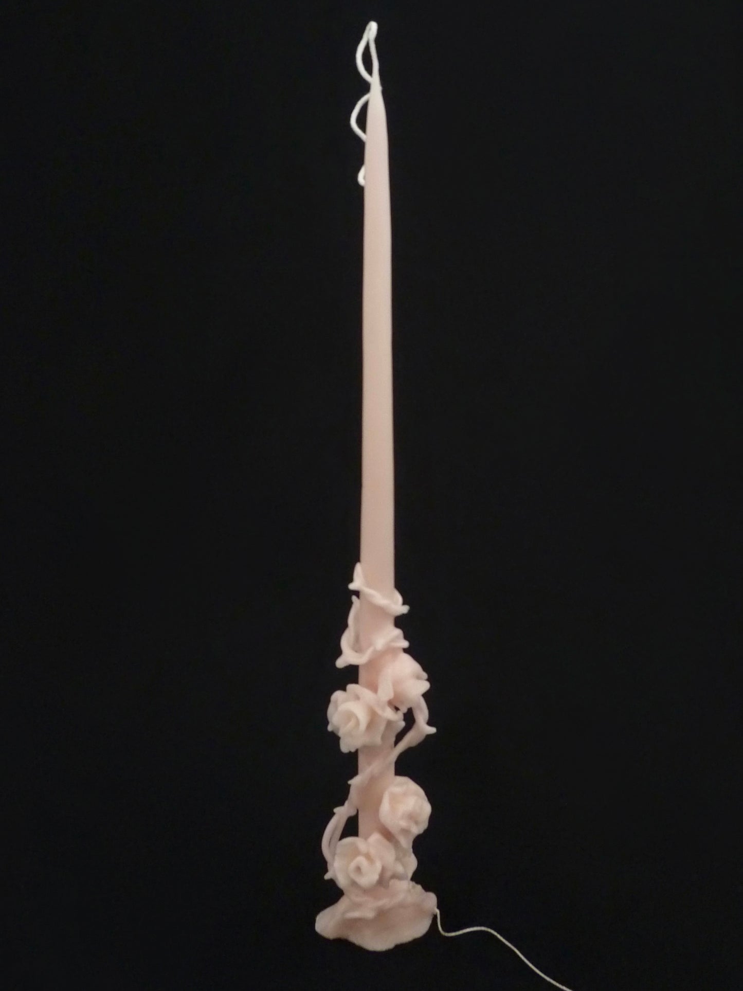 Сandle entwined with rose